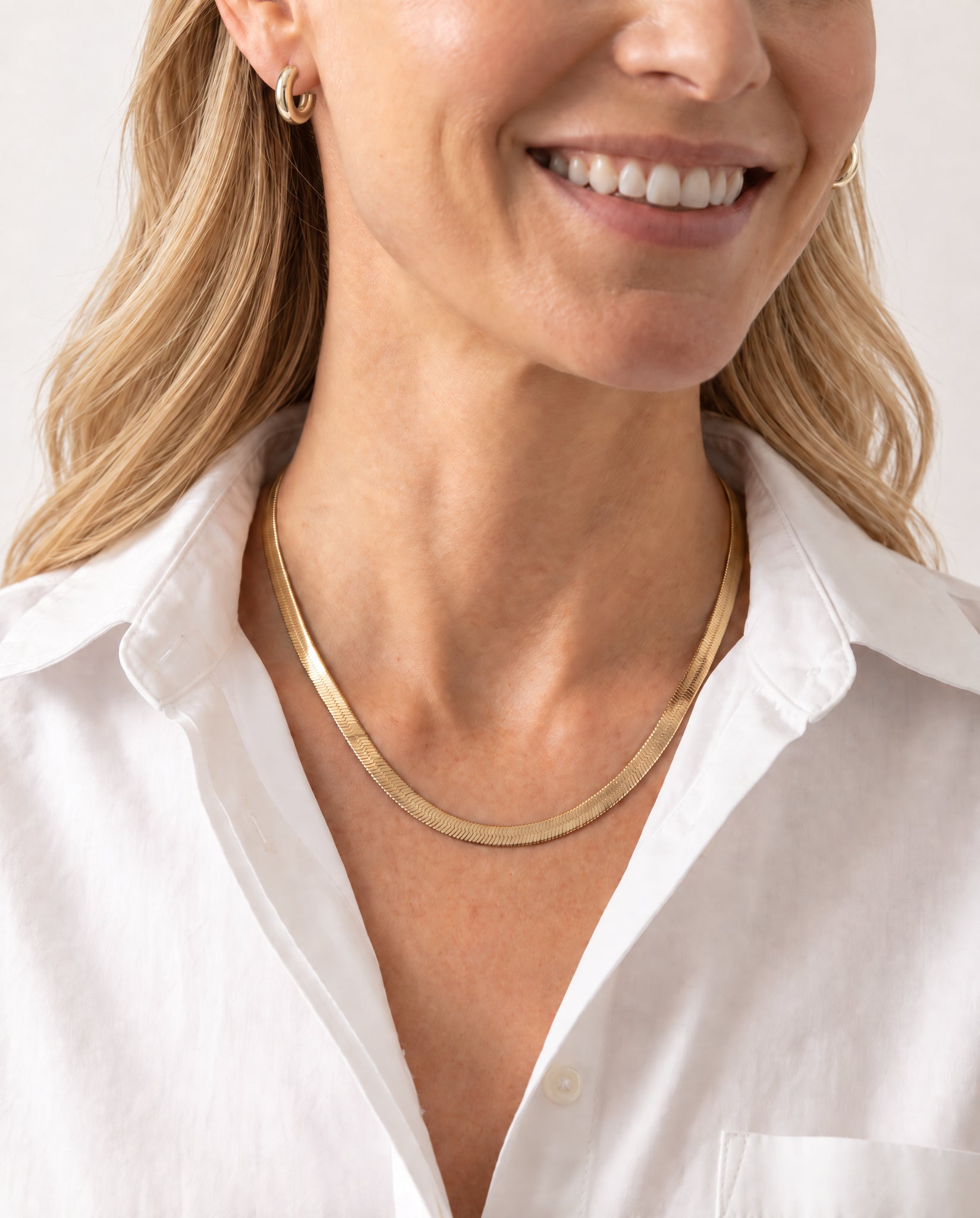 Woman wearing the Gold Snake Chain Necklace by Natalie Wood Designs
